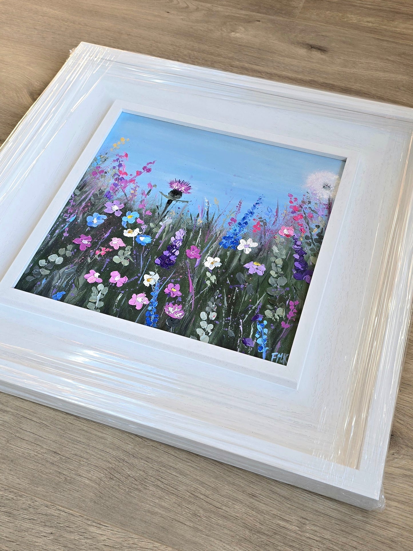 Framed painting of wildflowers