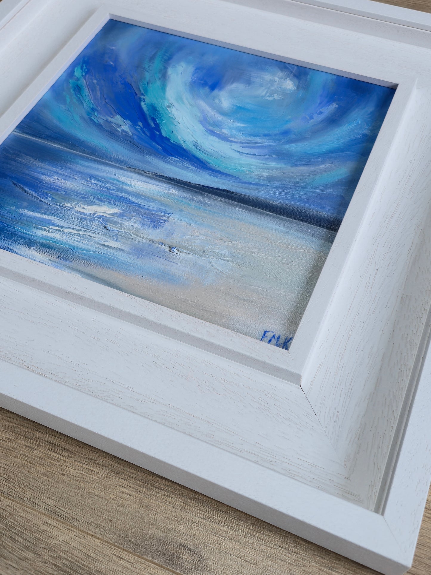 Framed coastal painting