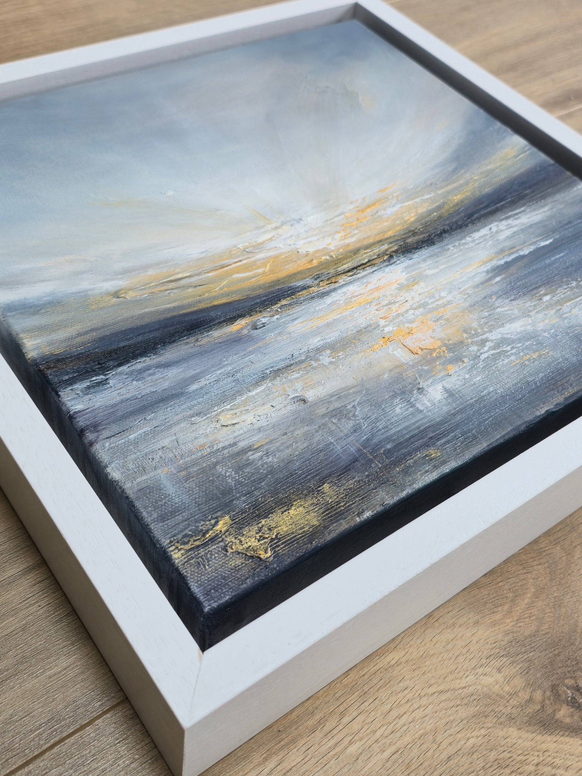 Framed abstract coastal painting