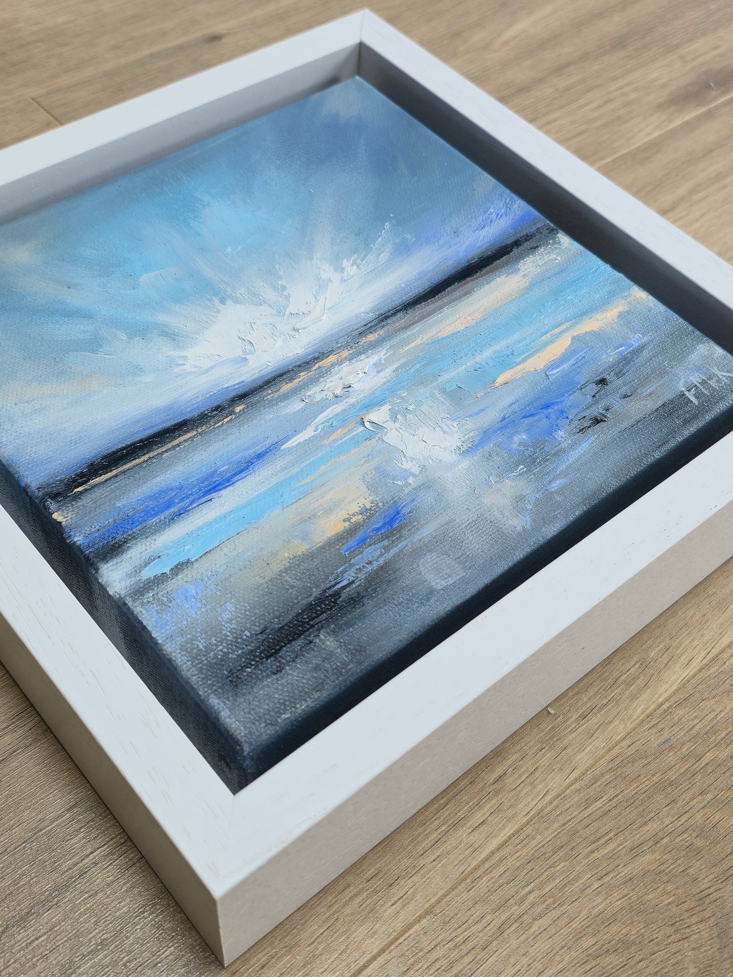 Framed coastal abstract painting