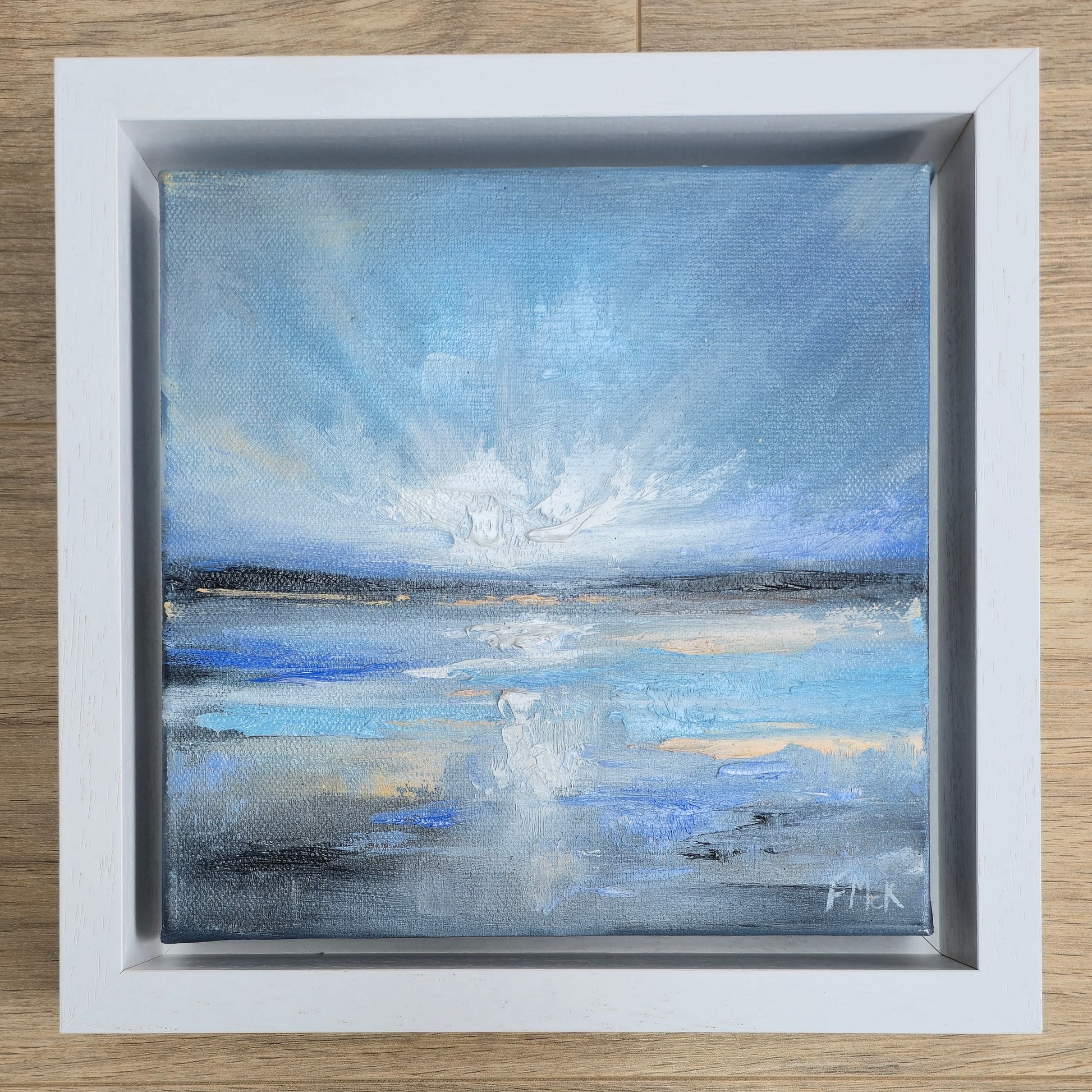 Framed coastal painting