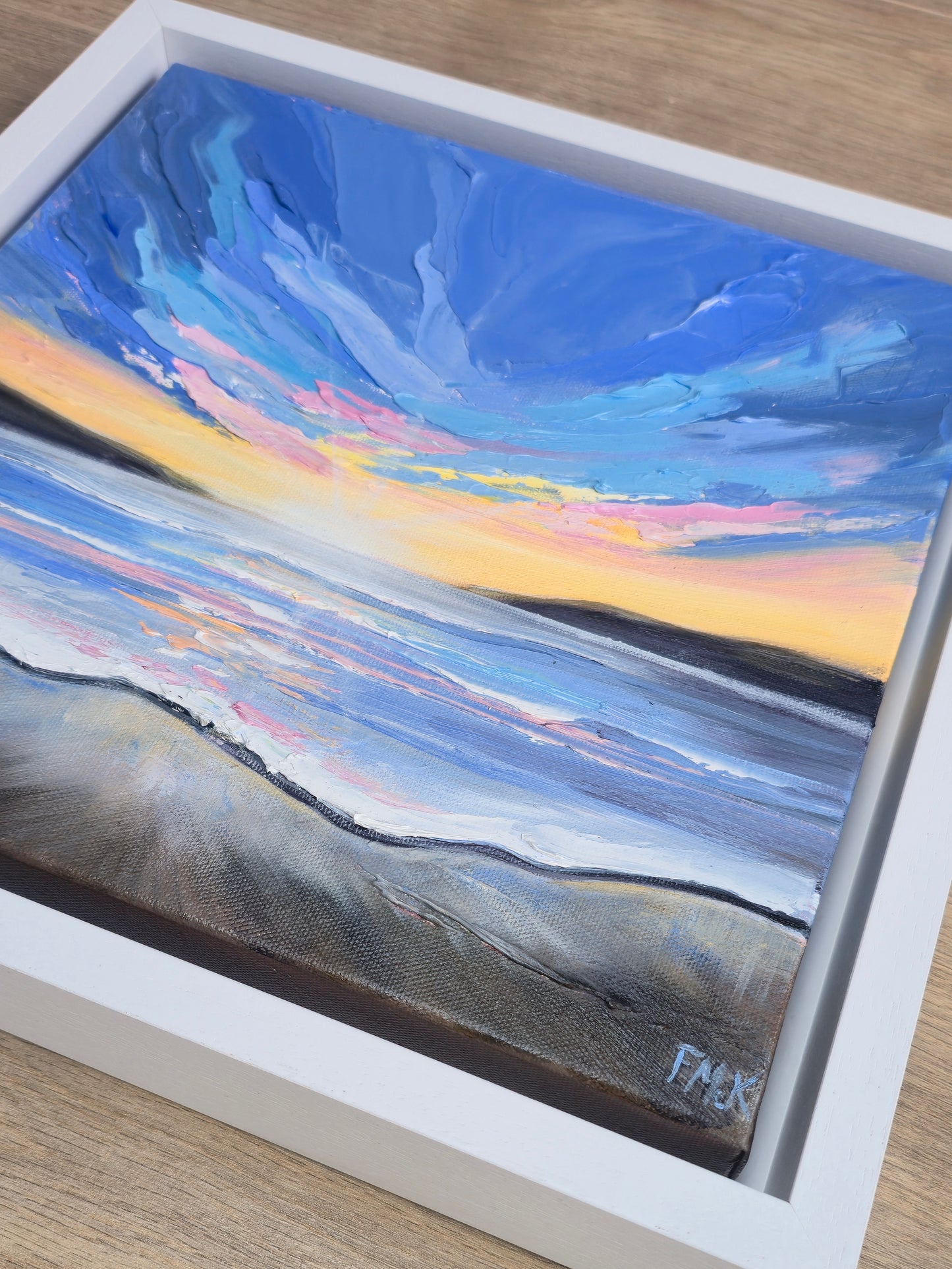 Coastal painting with a sunset