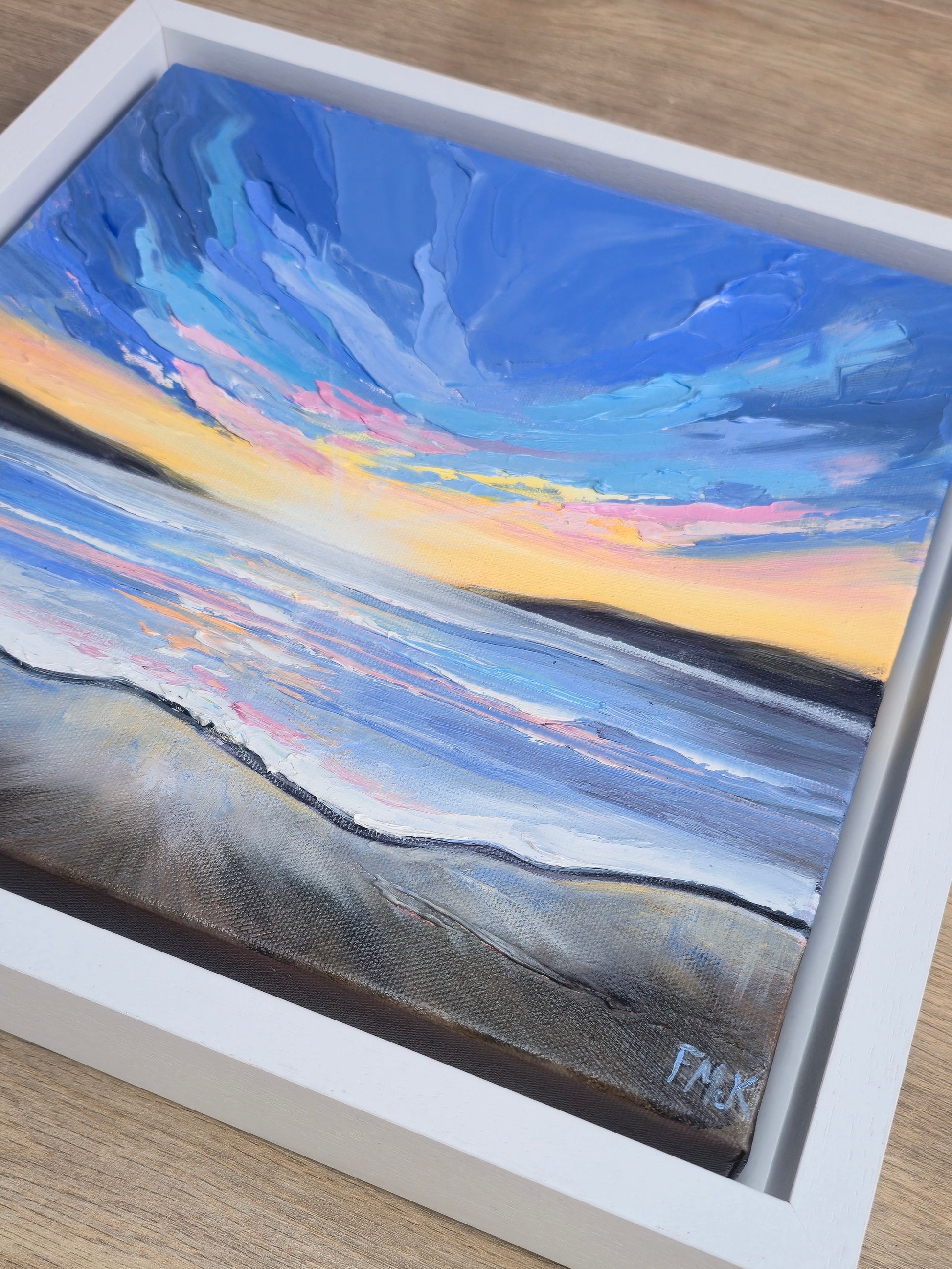 Coastal painting with a sunset