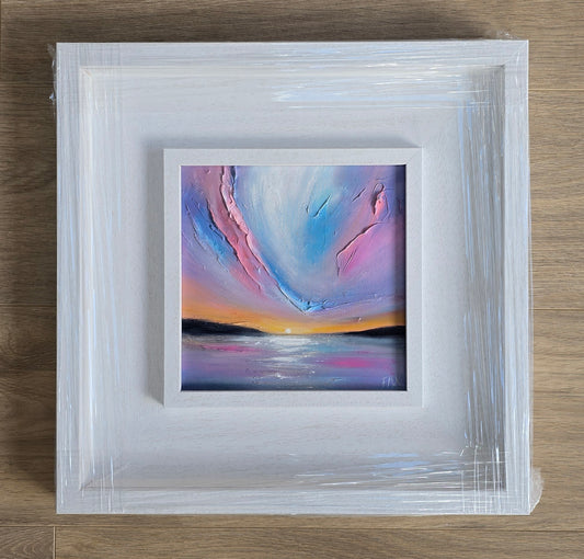 Framed abstract painting with sunset colours