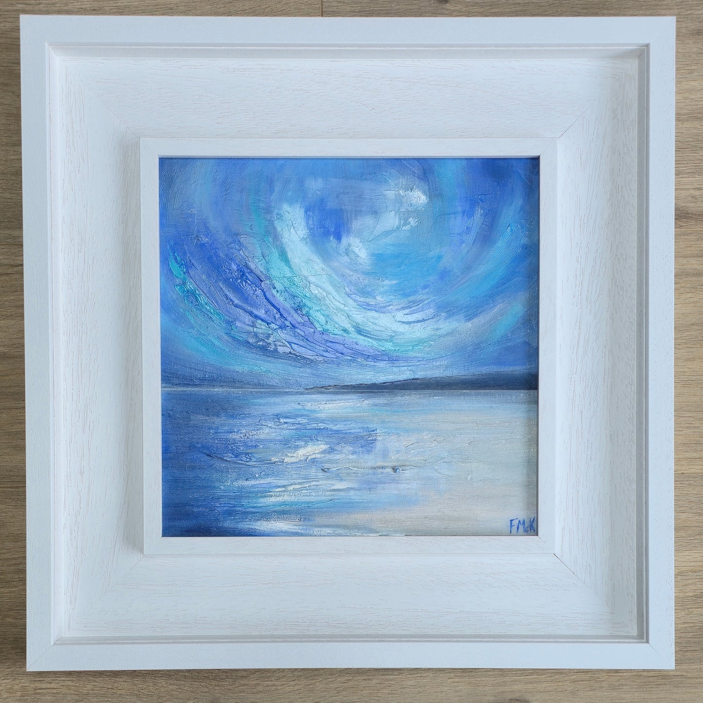 Framed coastal painting