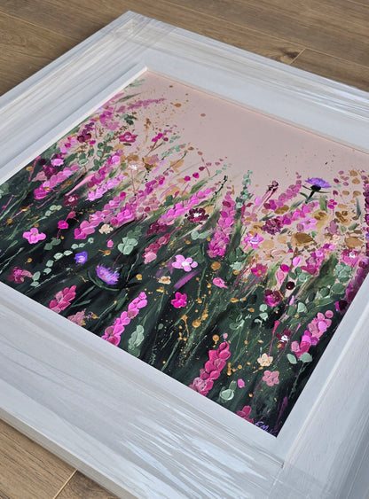Framed floral painting in a white frame