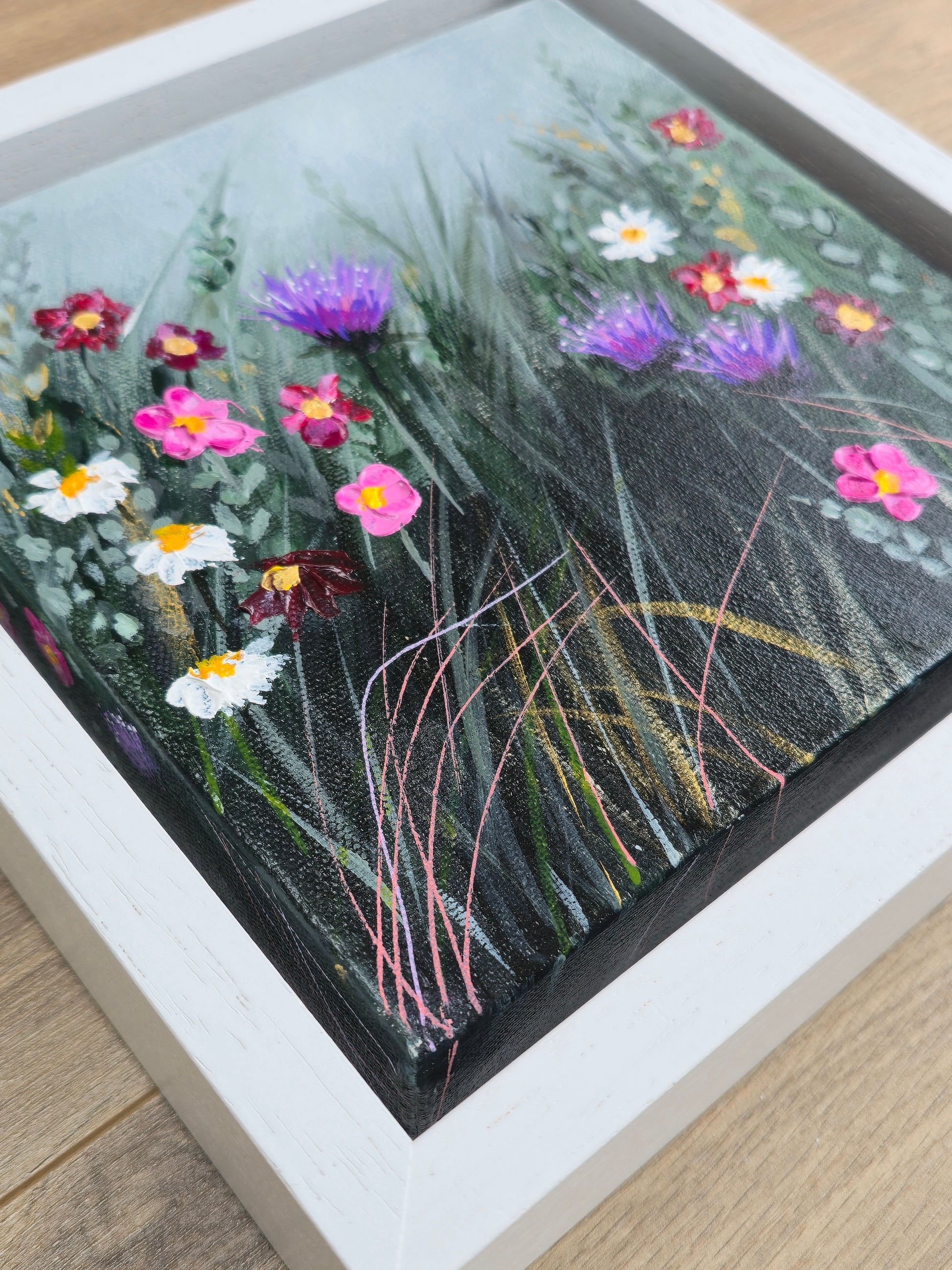 Framed artwork of wildflowers