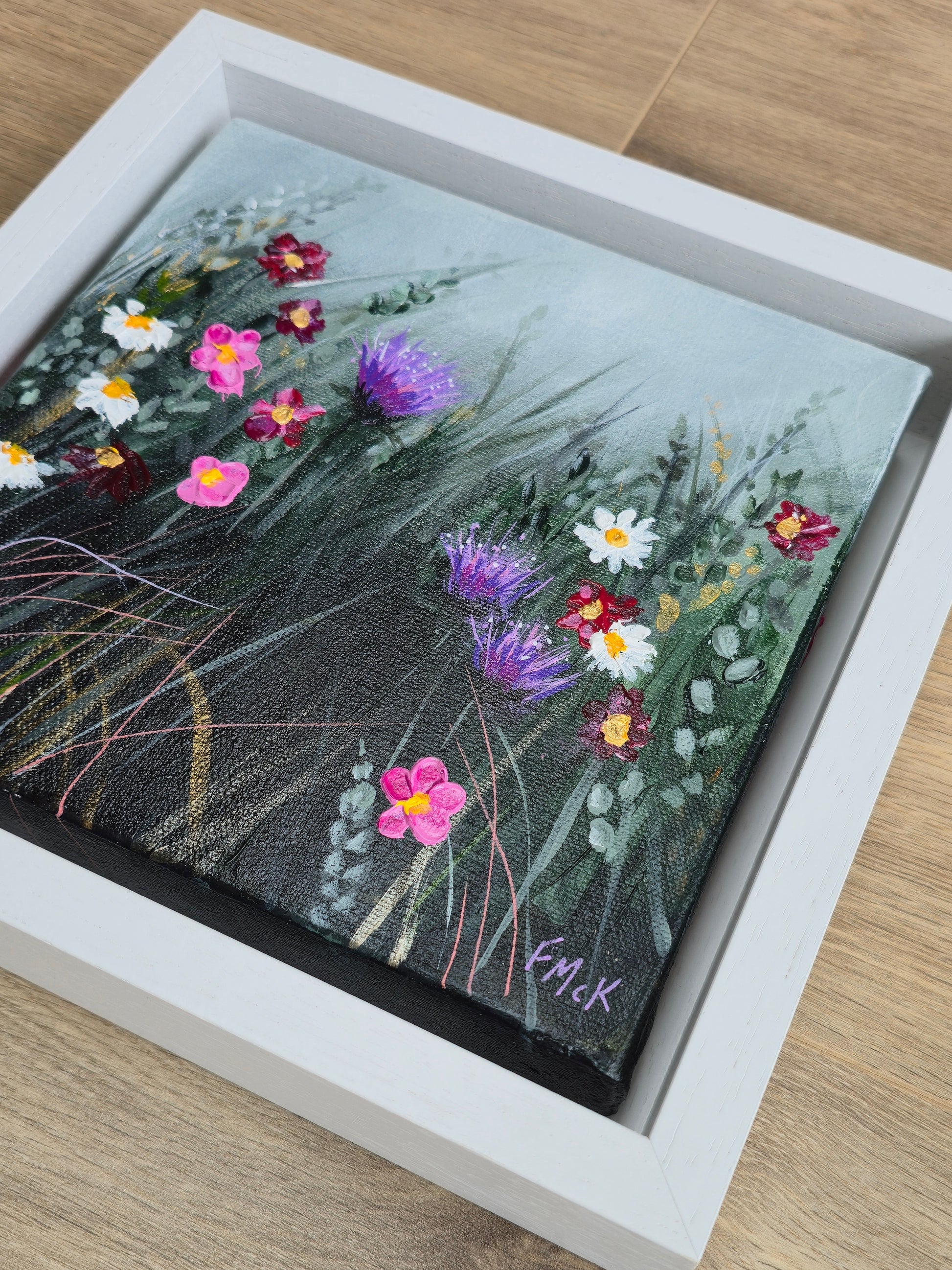 Framed painting of wildflowers
