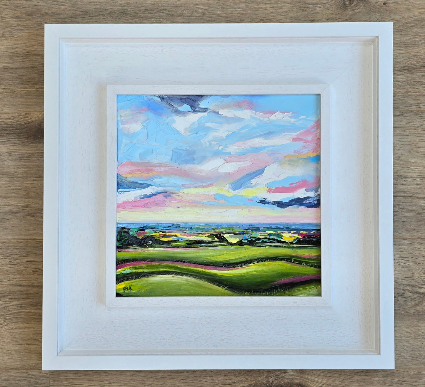 Colourful landscape painting framed