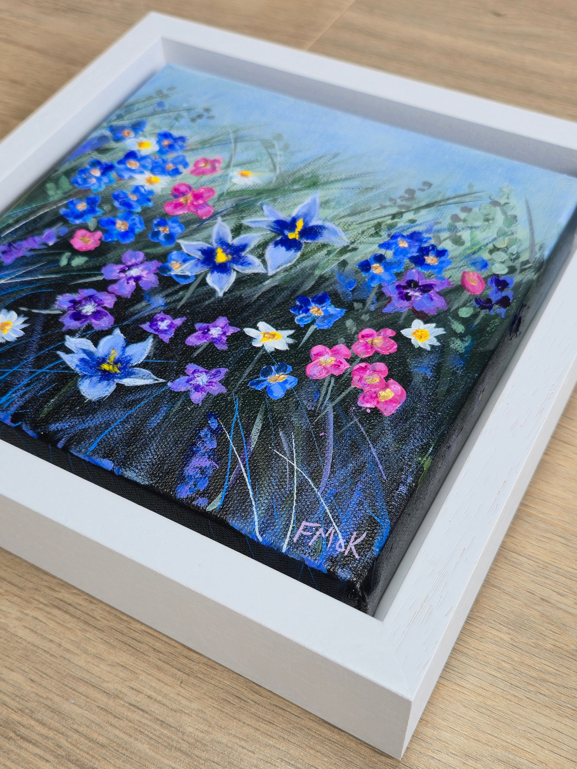 Framed painting of colourful flowers