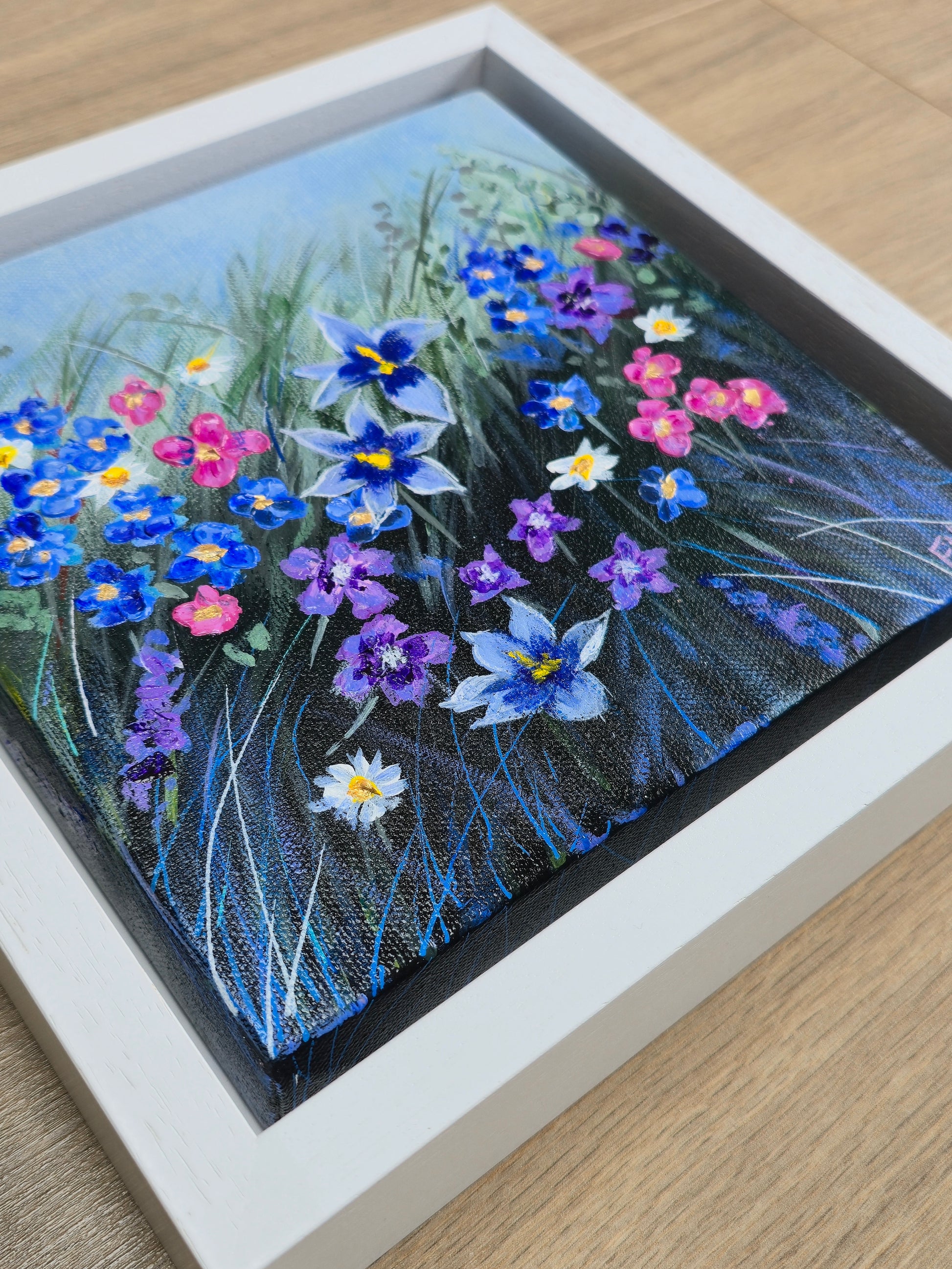 Framed artwork of wildflowers