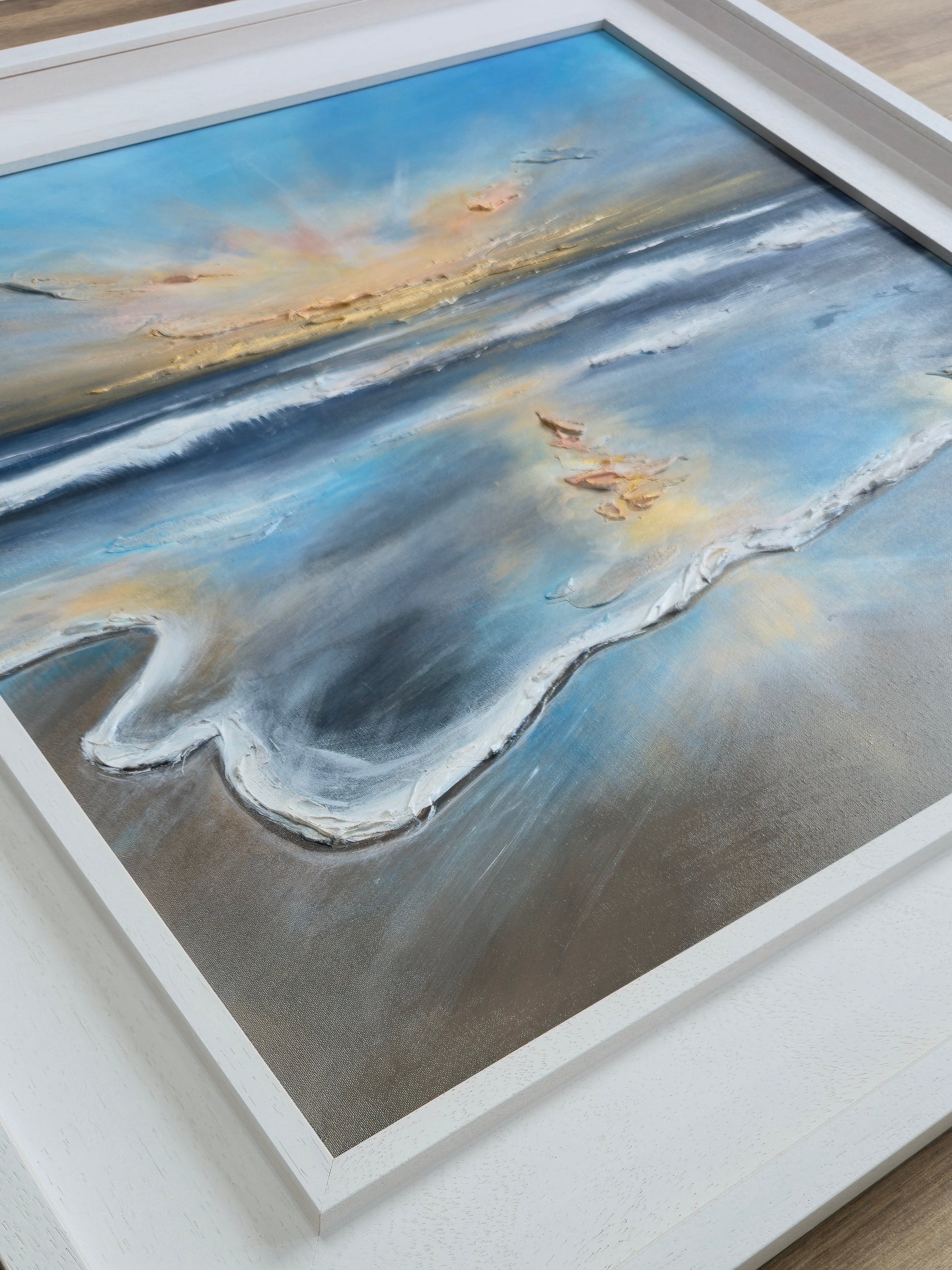 Framed coastal painting