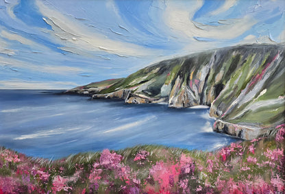 Painting of a coastal landscape with cliffs, sea, and pink flowers.