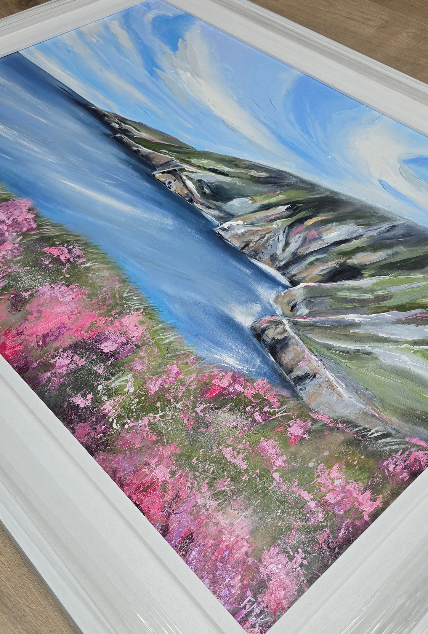 Slieve League cliff painting with pink flowers, and blue sky.