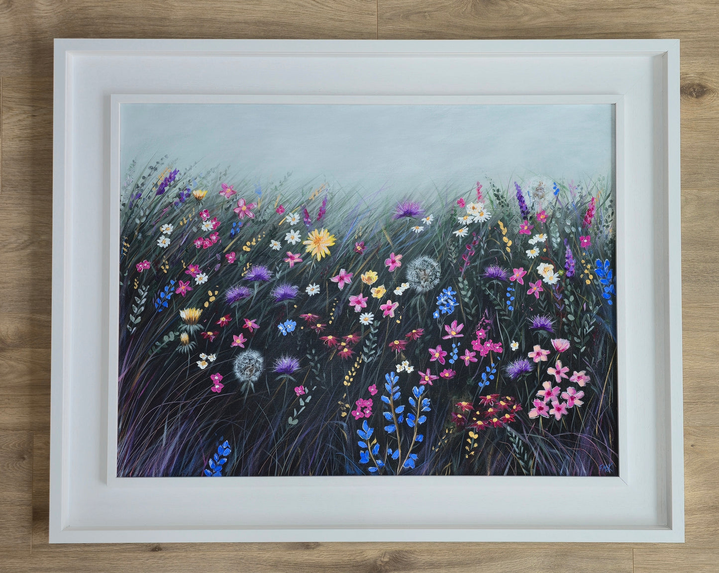 Framed artwork of colourful flowers