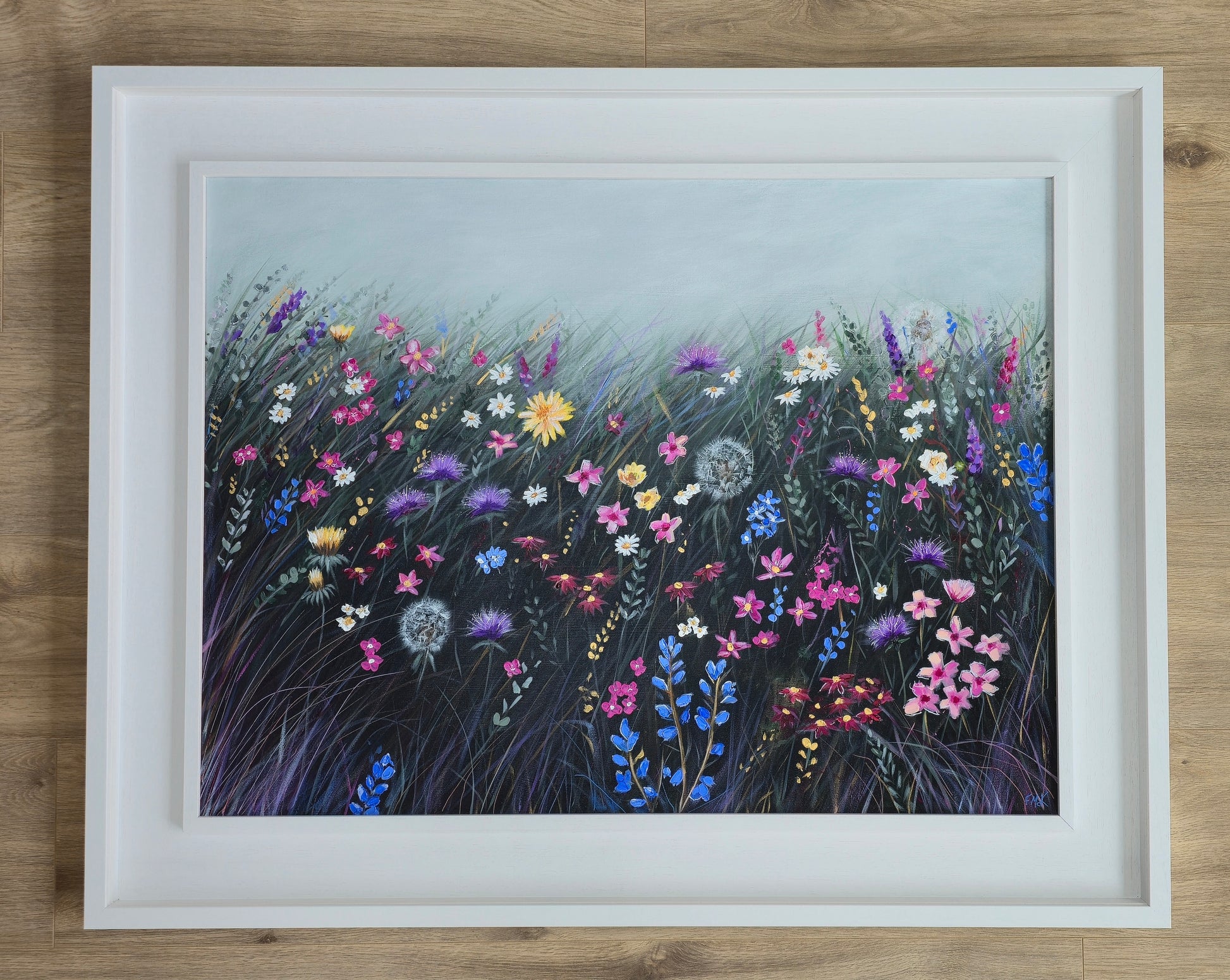 Framed artwork of colourful flowers
