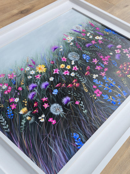 Framed artwork of colourful flowers