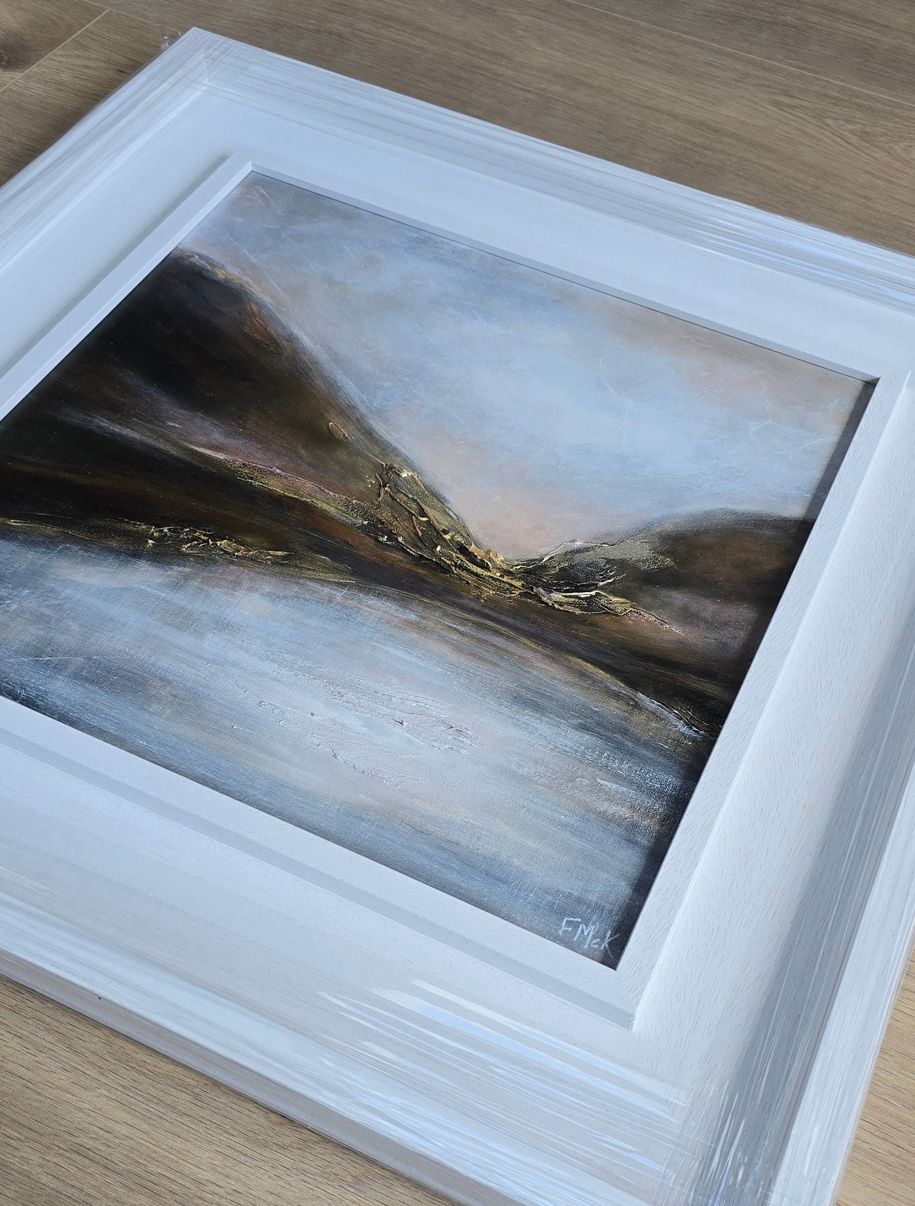 Framed abstract painting with a white border