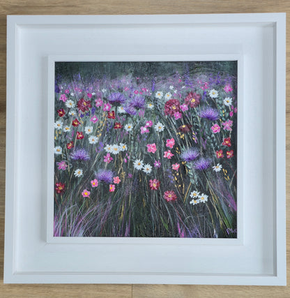 Framed artwork of a colourful floral field