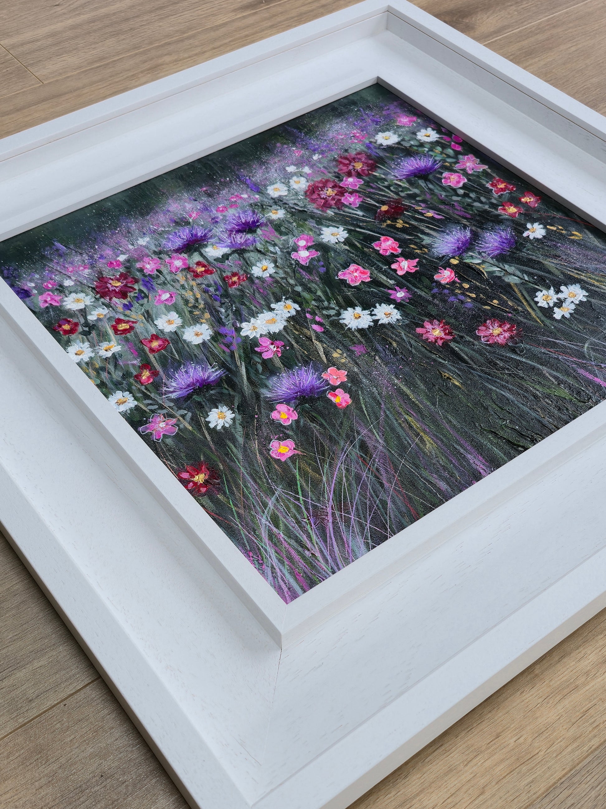 Framed artwork of a colourful field of flowers