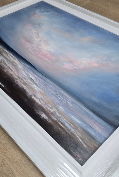 Framed painting of a landscape with a pink sky.