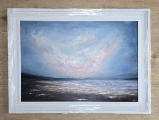 Framed painting of a landscape with a blue sky, pink clouds and water.
