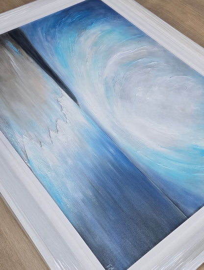Coastal painting with blue and gray swirls in a white frame.
