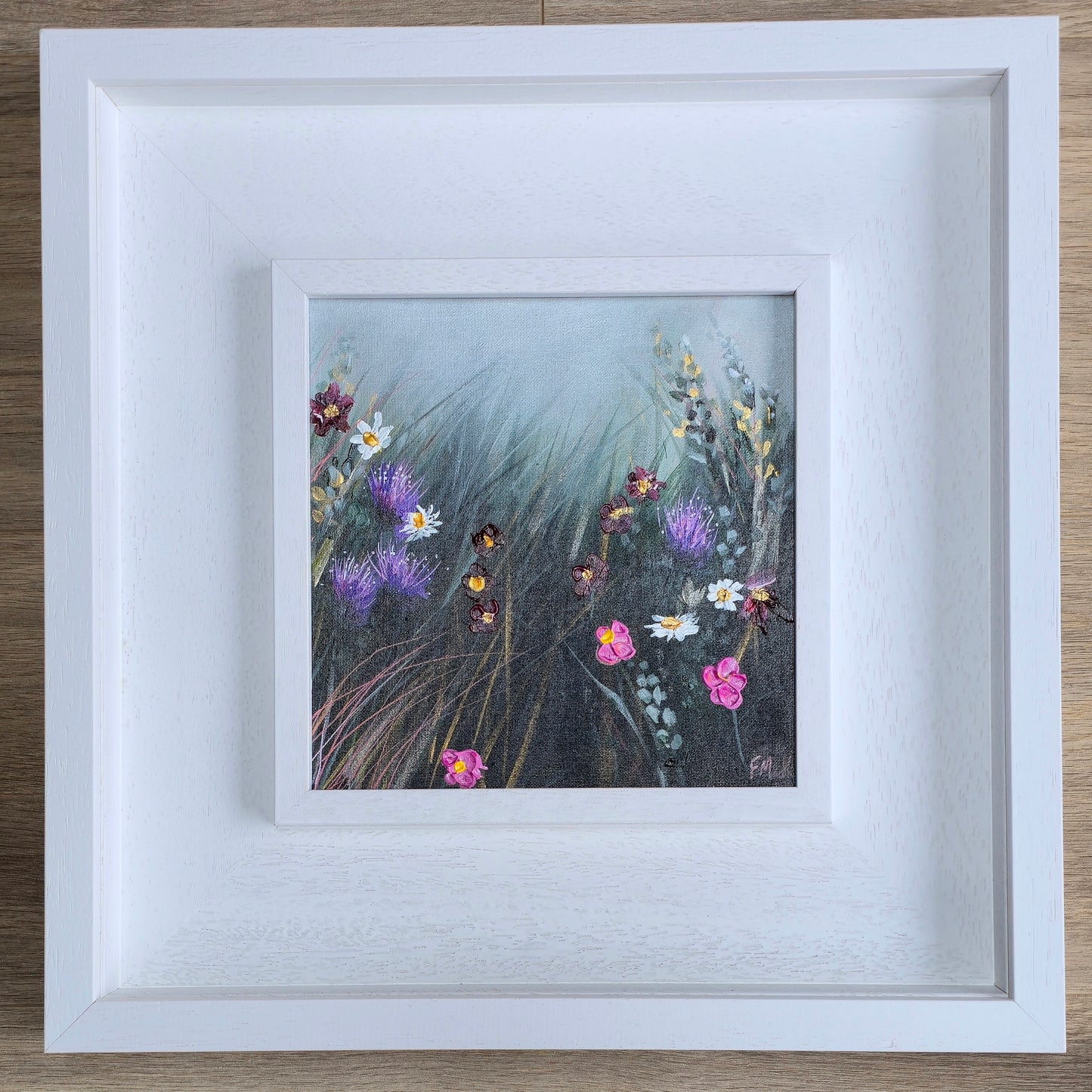 Framed artwork of wildflowers