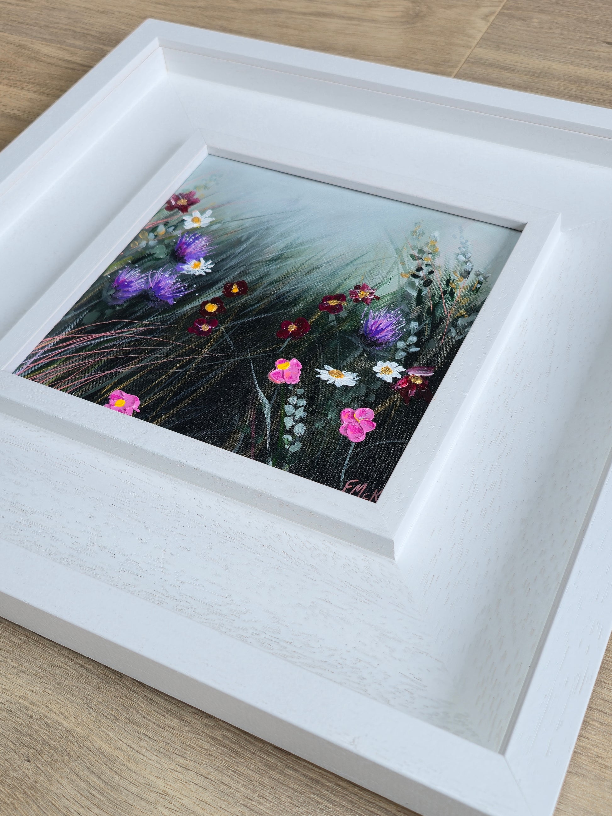 Framed painting of wildflowers