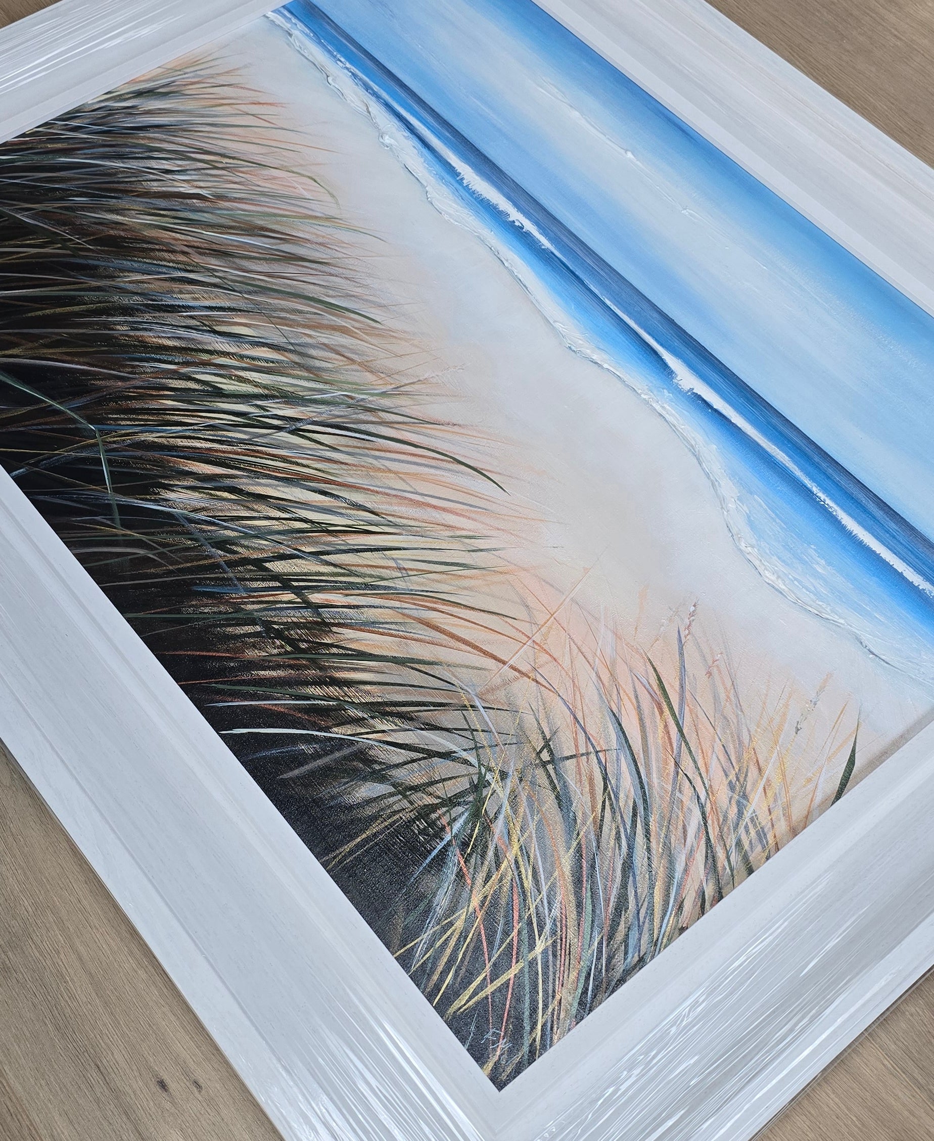 Close-up of a ocean and grass in the foreground