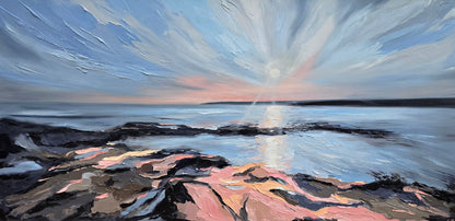 Sunset over a rocky coastline 