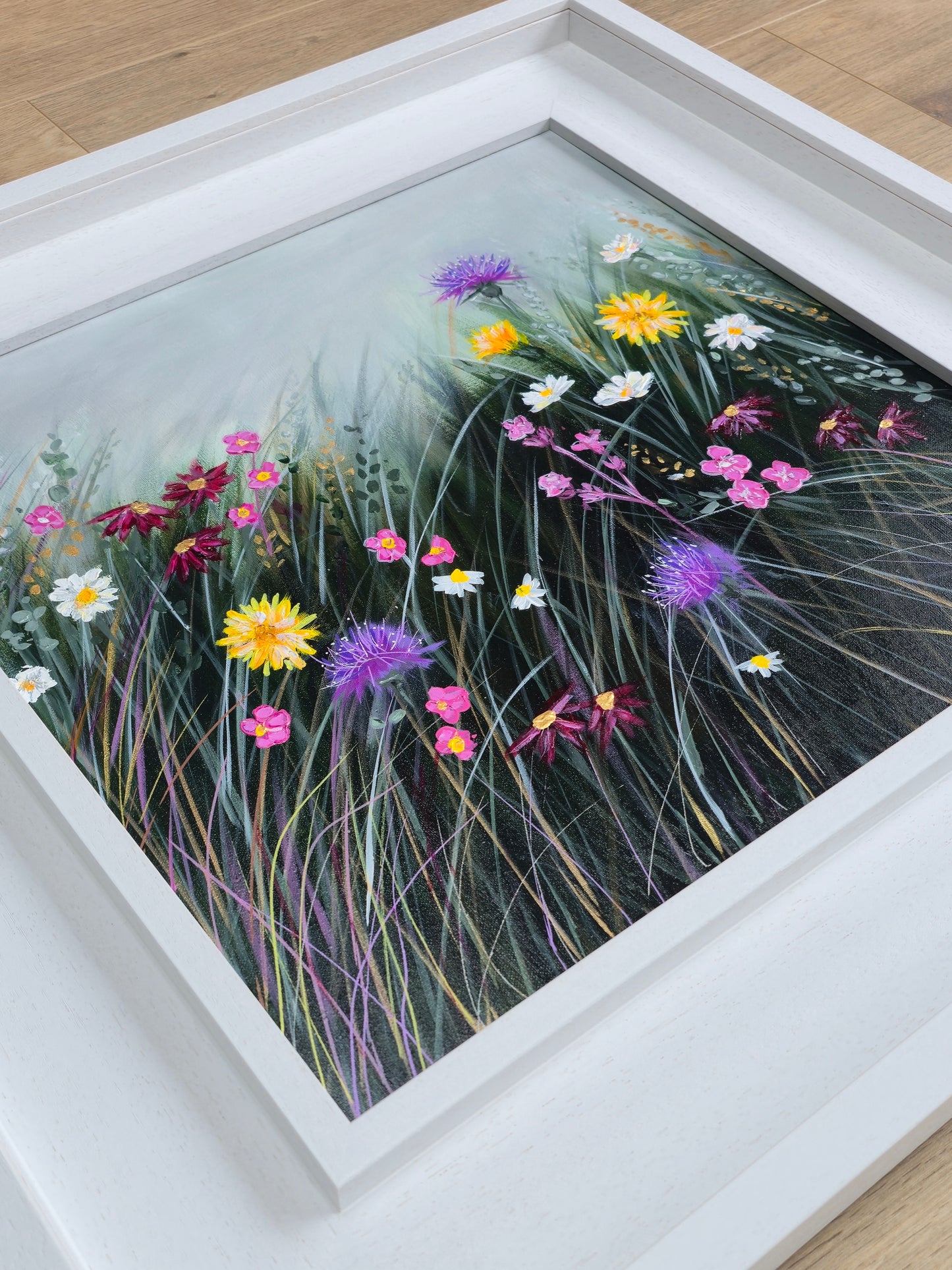 Framed artwork of colourful flowers
