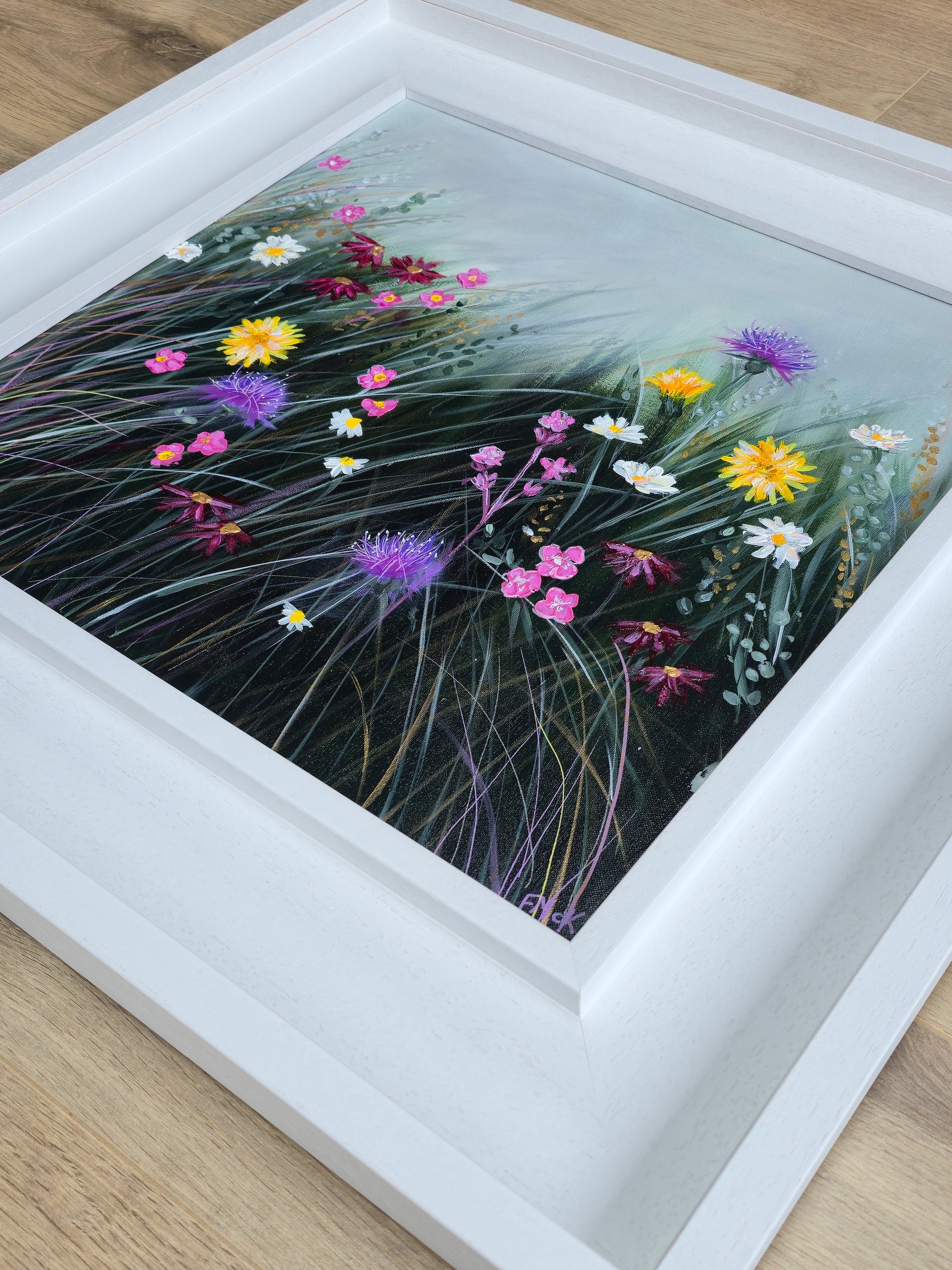 Framed artwork of colourful flowers