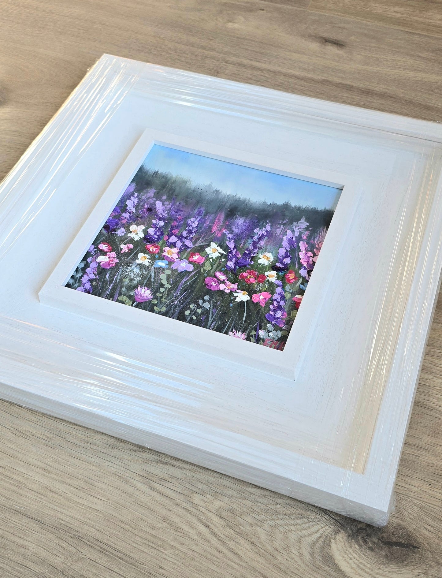 Framed artwork of a field of flowers